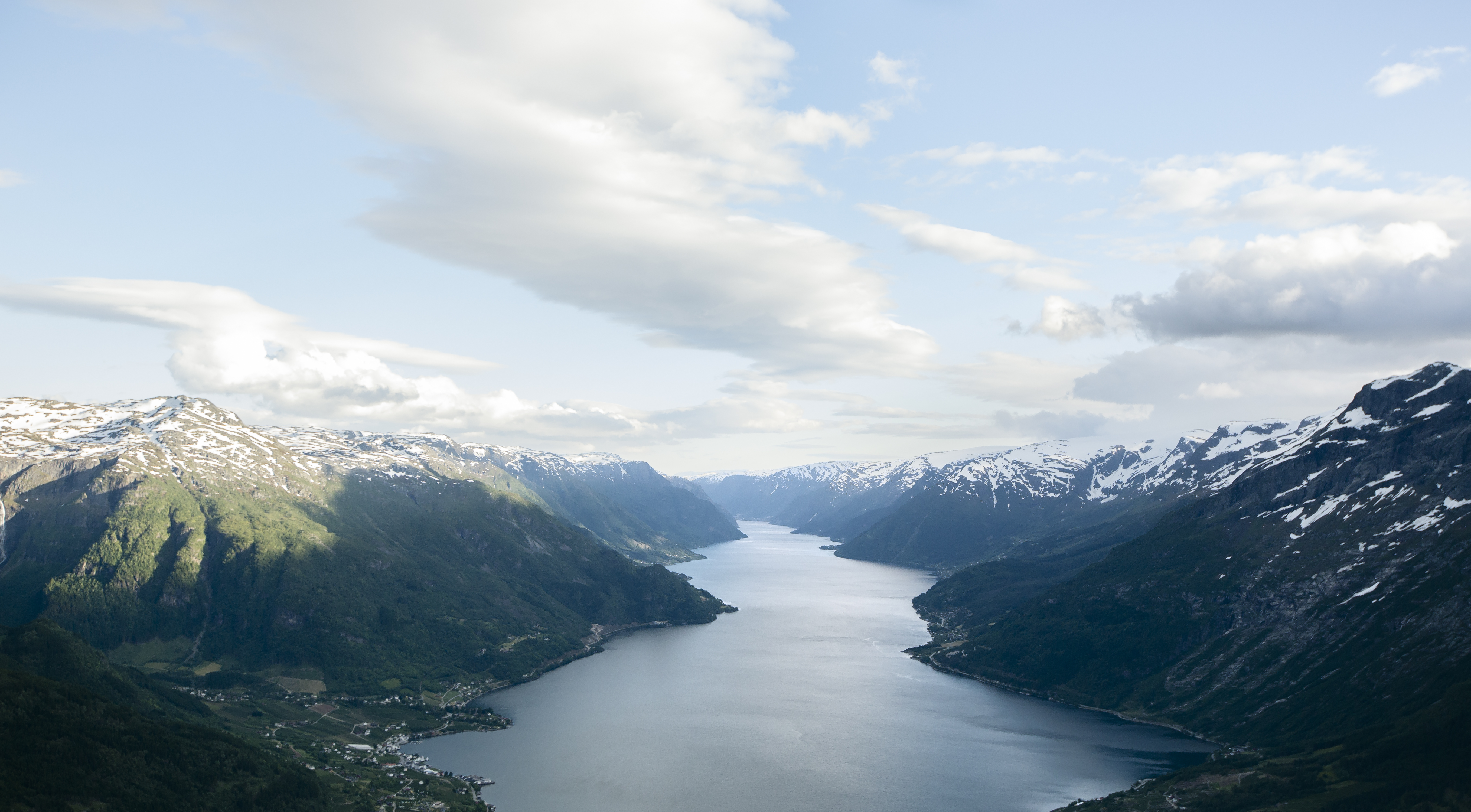 Norwegian fjord lanscape with blue sky and clouds